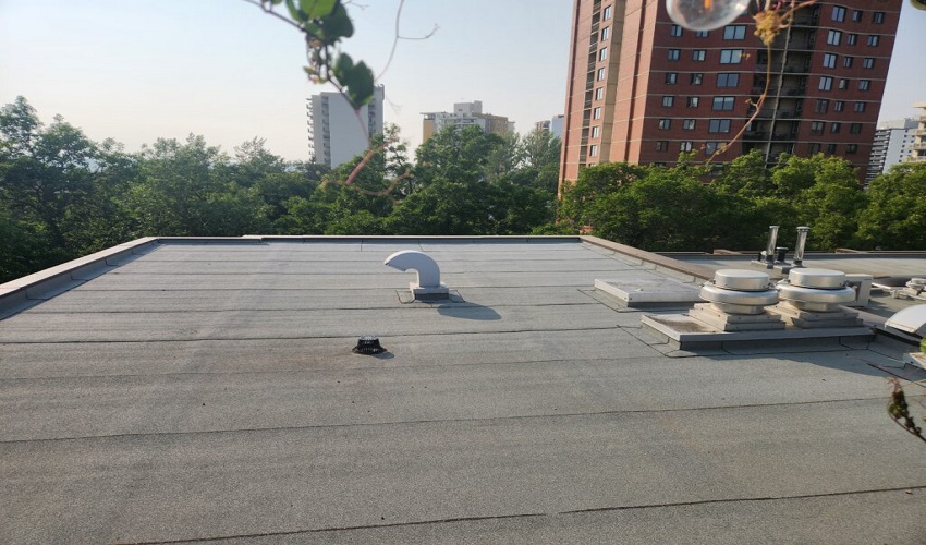 Combating Flat Roof Drainage Challenges Through Professional Torch On Roofing